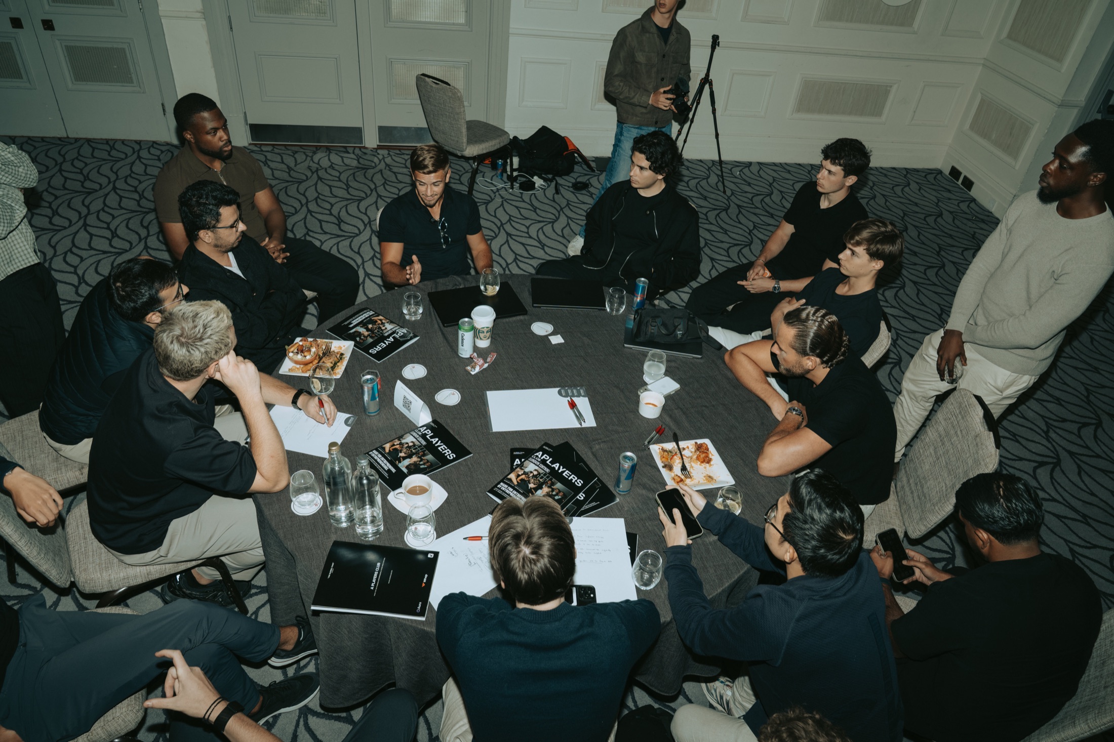 Cameron England leading a roundtable in London